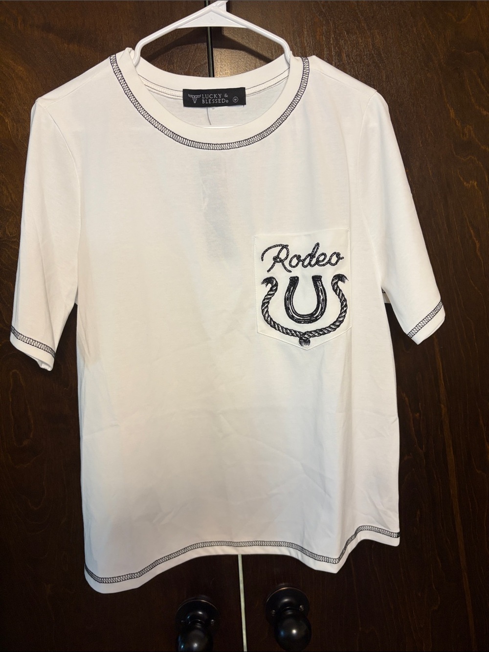 NWT white tee with pocket rodeo embroidered   Blk zig zag trim